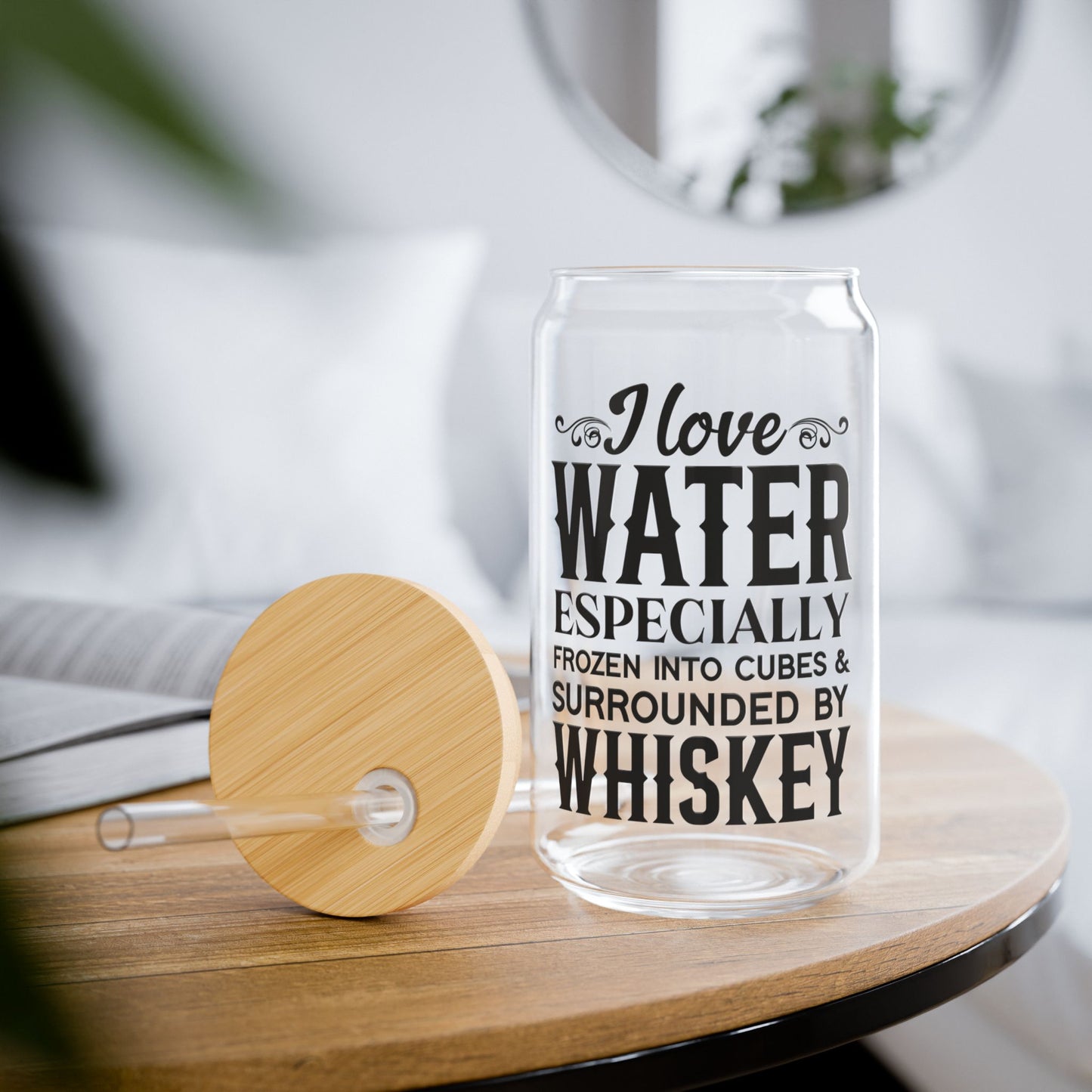 Glass with humorous text on a wooden table